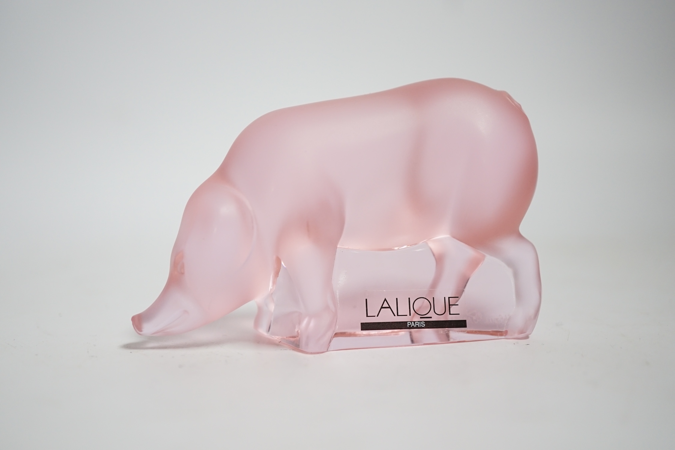 A modern Lalique pink glass pig, signed, 9cm wide
